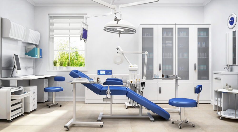 Empty dental room with chair in the middle.