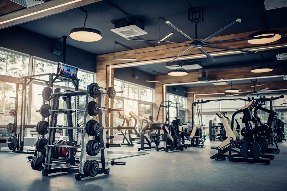 Empty gym with various pieces of gym equipment.